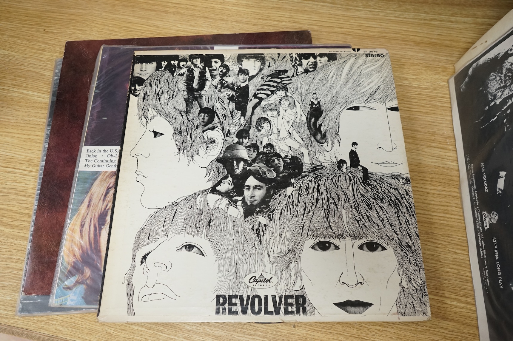 Seven The Beatles LP record albums including; Rubber Soul, two copies of Revolver, The Beatles Vol.1 - Chilean pressing, Love Songs, John Lennon; Rock ‘n’ Roll, Paul McCartney RAM - Chilean pressing.